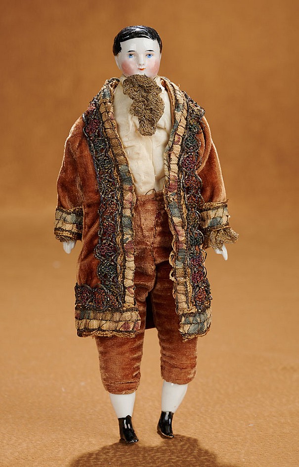 9" German porcelain boy in brown velvet suit